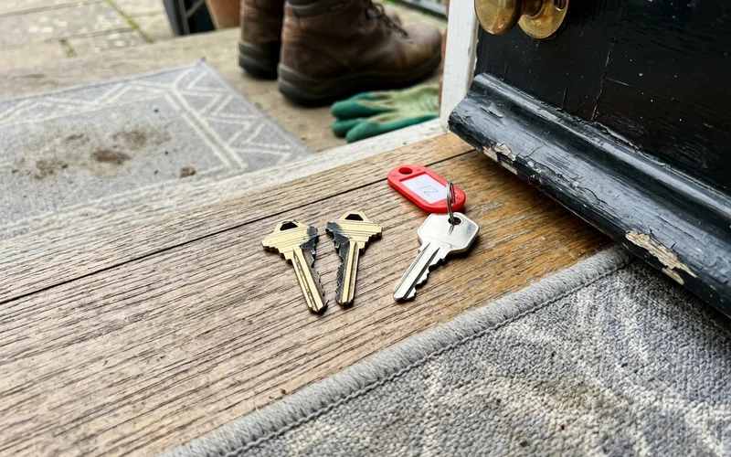 Snapped key halves beside a new replacement key