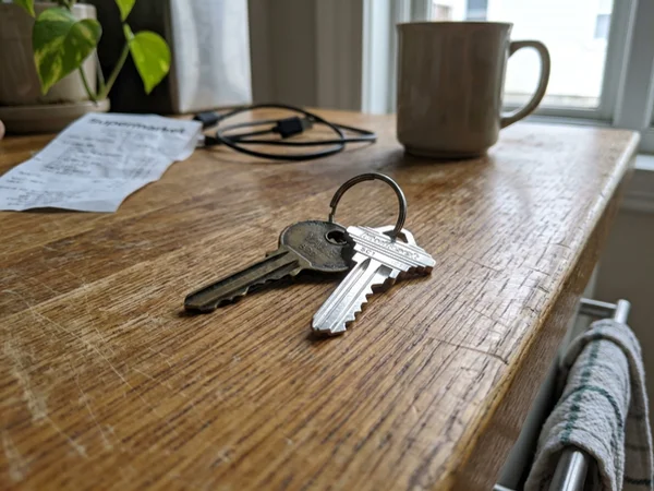 Worn key compared with a freshly cut replacement