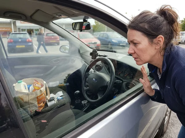 Keys visible on the seat of a locked car in Waterford